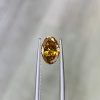 0.80 Ct Fancy Intense Orange Yellow/I1 Oval Diamond