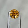 0.64 Ct Fancy Brownish Yellow/I1 Round Diamond